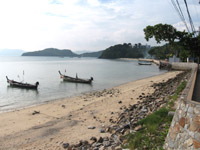 Longtail boats moored at Cape Panwa Beach