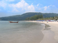 Longtail boats moor at the southern end of Kamala Beach