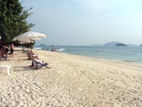 there are a few deck chairs dotted along the beach so you can relax and work on your tan