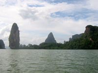 the limestone outcrops are interspersed with forest and small beaches