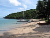 Yachts moor at Ao Yon Beach while others play in the water