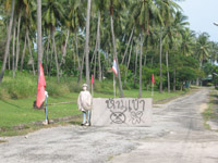 A dummy guards the entrance to a small resort